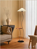Vintage-style floor lamp ambiance, living room sofa, several high-end bedroom storage racks, standing desk lamp with artistic touch